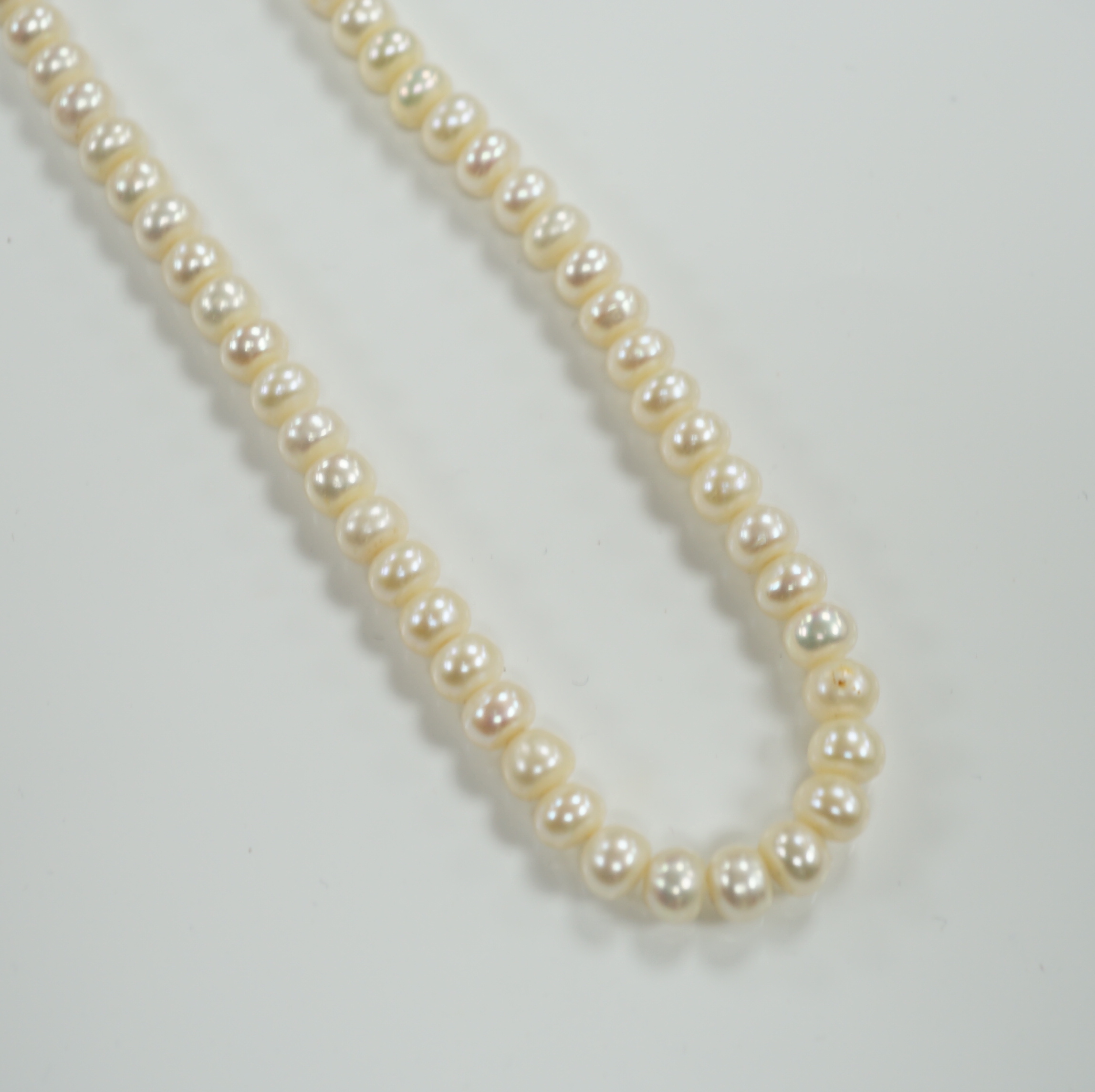 A single strand cultured pearl necklace, with 9ct clasp, 46cm.